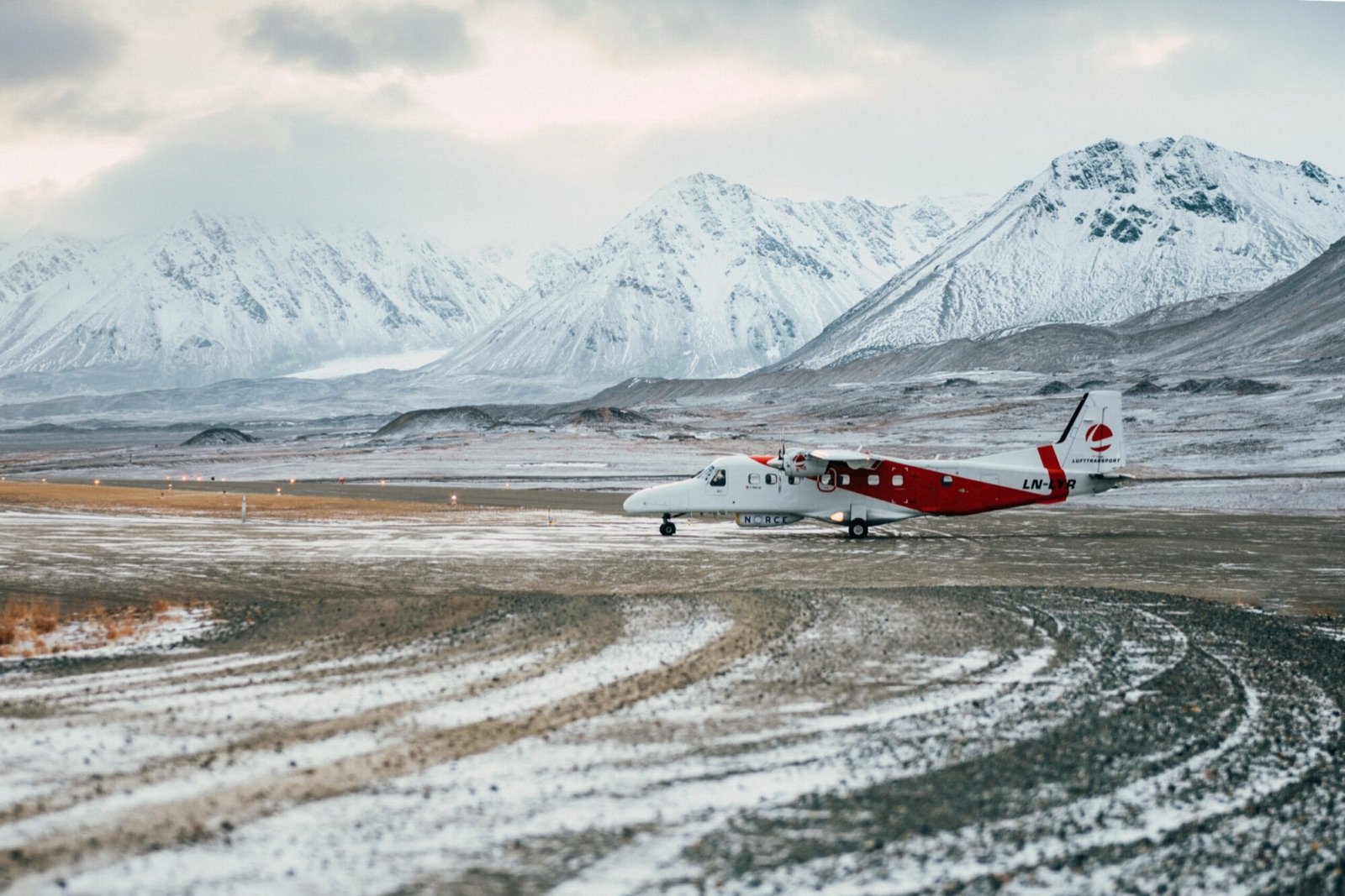A small plane on the gravel runway at Ny-Ålesund airport