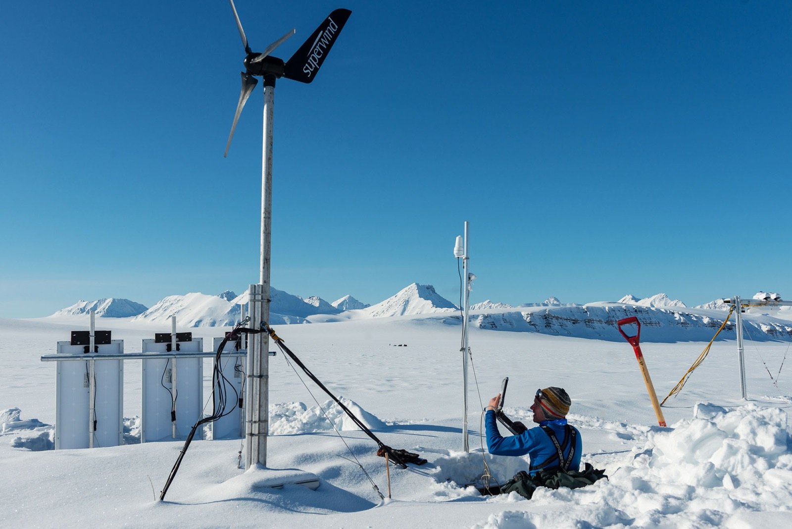 A researcher at a weather station on the Kongsvegen glacier